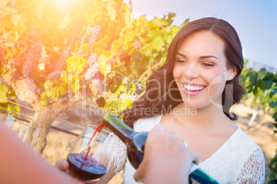 Beautiful Young Adult Woman Enjoying Glass of Wine in The Vineyard