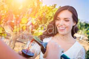 Beautiful Young Adult Woman Enjoying Glass of Wine in The Vineyard
