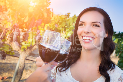 Beautiful Young Adult Woman Enjoying Glass of Wine in The Vineyard