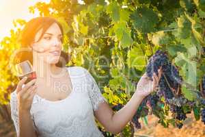 Beautiful Young Adult Woman Enjoying Glass of Wine n The Vineyard