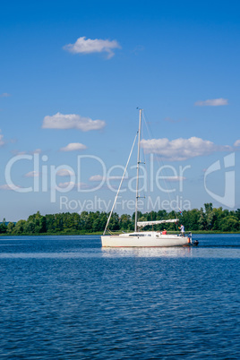 White Sailing Boat on the River.