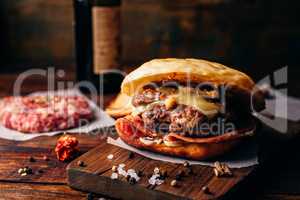 Homemade Burger on Cutting Board.