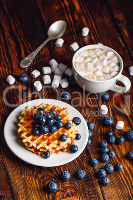 Waffles with Blueberry and Hot Chocolate.