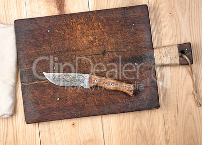 empty old wooden kitchen cutting board and knife