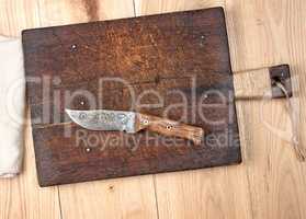 empty old wooden kitchen cutting board and knife