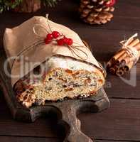 slice traditional European cake Stollen with nuts and candied fr