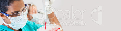 Asian Female Scientist Pipette Blood Sample in Medical Research