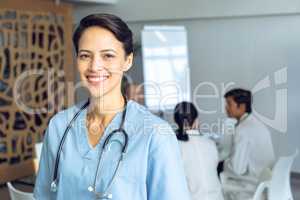 Female surgeon looking at camera in the hospital