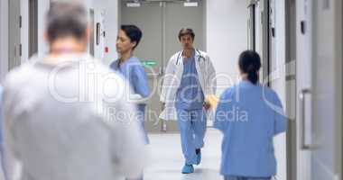 Male surgeon walking in corridor at hospital