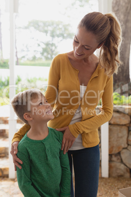 Mother and son interacting with each other at home