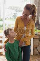 Mother and son interacting with each other at home