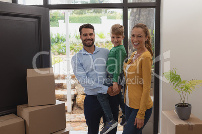 Happy Caucasian family looking at camera in a comfortable home