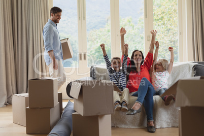 Family having fun in living room at home