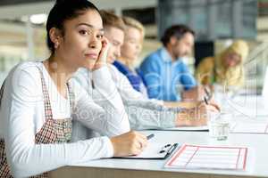 Businesswoman looking away during a business meeting in a modern office