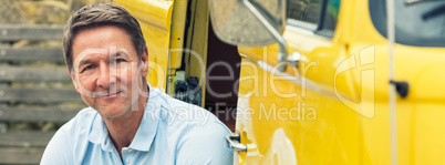 Happy Middle Aged Man Sitting In Van Panorama Web Banner