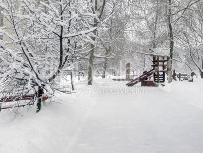 city park after snowfall at day