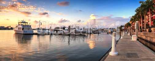 Sunset over the boats in Esplanade Harbor Marina in Marco Island