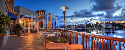 Outdoor dining at the Village at Venetian Bay at sunrise in Napl