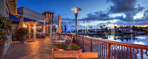 Outdoor dining at the Village at Venetian Bay at sunrise in Napl