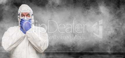 Man Wearing Hazmat Suit and Goggles In Smokey Room Banner