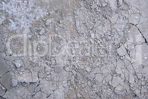 fragment of gray cracked cement floor