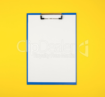 blue paper holder with white blank sheets  on yellow background