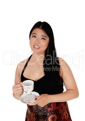 Happy smiling Asian woman with a coffee cup