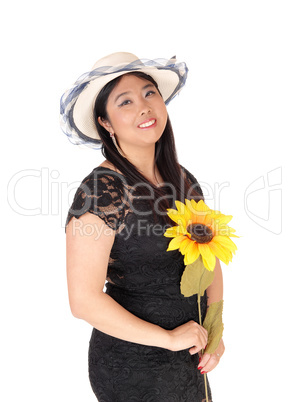 Happy Chinese woman with a hat and sunflower