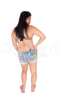 Young Asian woman standing with tools from her back