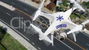 Police Unmanned Aircraft System, (UAS) Drone Flying Above A City