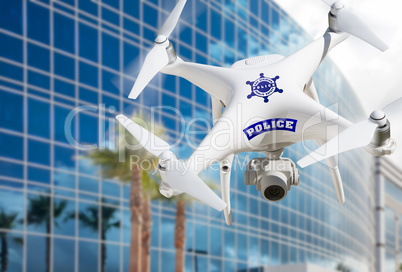 Police Unmanned Aircraft System, (UAS) Drone Flying by Building