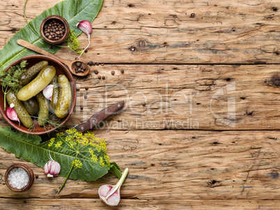 Homemade Pickles On Wooden Table