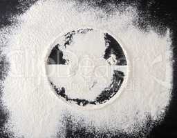 sprinkled white flour, round imprint from sieve
