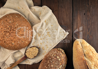 baked various breads on a beige kitchen towel