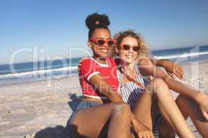 Female friends relaxing together on the beach