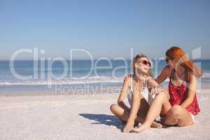 Female friends having fun together on the beach