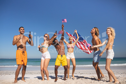 Group of friends having fun together on the beach