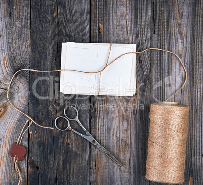 tied up with a rope a stack of empty cards