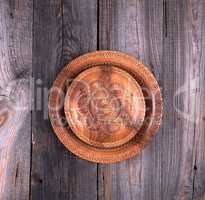 empty round brown carved decorative plate