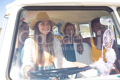 Group of female friends having fun in a camper van