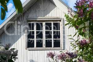 aged window of old white country house