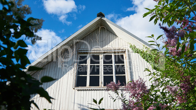 aged window of old white country house