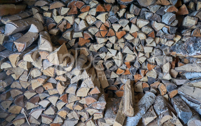 impaled firewood lies in a woodpile texture