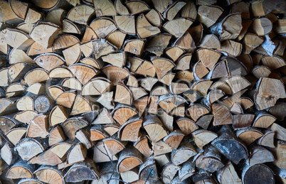 impaled firewood lies in a woodpile texture