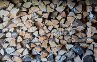 impaled firewood lies in a woodpile texture