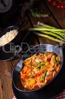 colorful turkey fricassee with asparagus and paprika