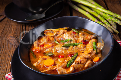 colorful turkey fricassee with asparagus and paprika