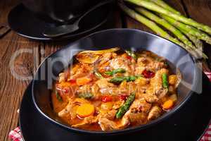 colorful turkey fricassee with asparagus and paprika