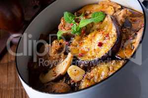 Veal goulash with baked aubergine and herbs