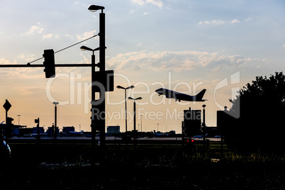 traffic and airplane at evening